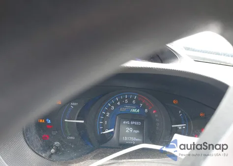 2012 Honda Insight from USA, damaged, VIN JHMZE2H36CS000448